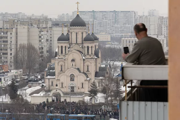 A man is taking a photo of those who came to bid farewell to Alexei Navalny at the Church of the Icon of the Mother of God Soothe My Sorrows, 1 March 2024 / Photo: Meduza