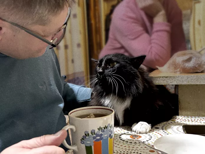 Gregory Winter with his cat. (A “Tea for Two”)